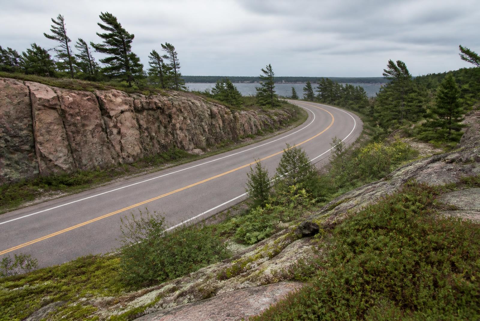 Granite shoreline and white pines along Highway 559 in Carling Township
